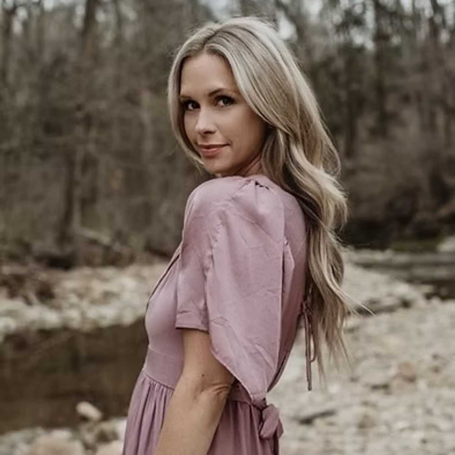 Portrait of Lora Dias, a professional stylist at Salon Stone & Spa, showcasing their expertise and style.