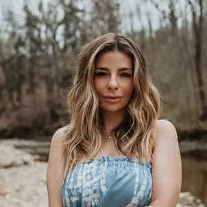 Portrait of Lauren Tomasino, a professional stylist at Salon Stone & Spa, showcasing their expertise and style.