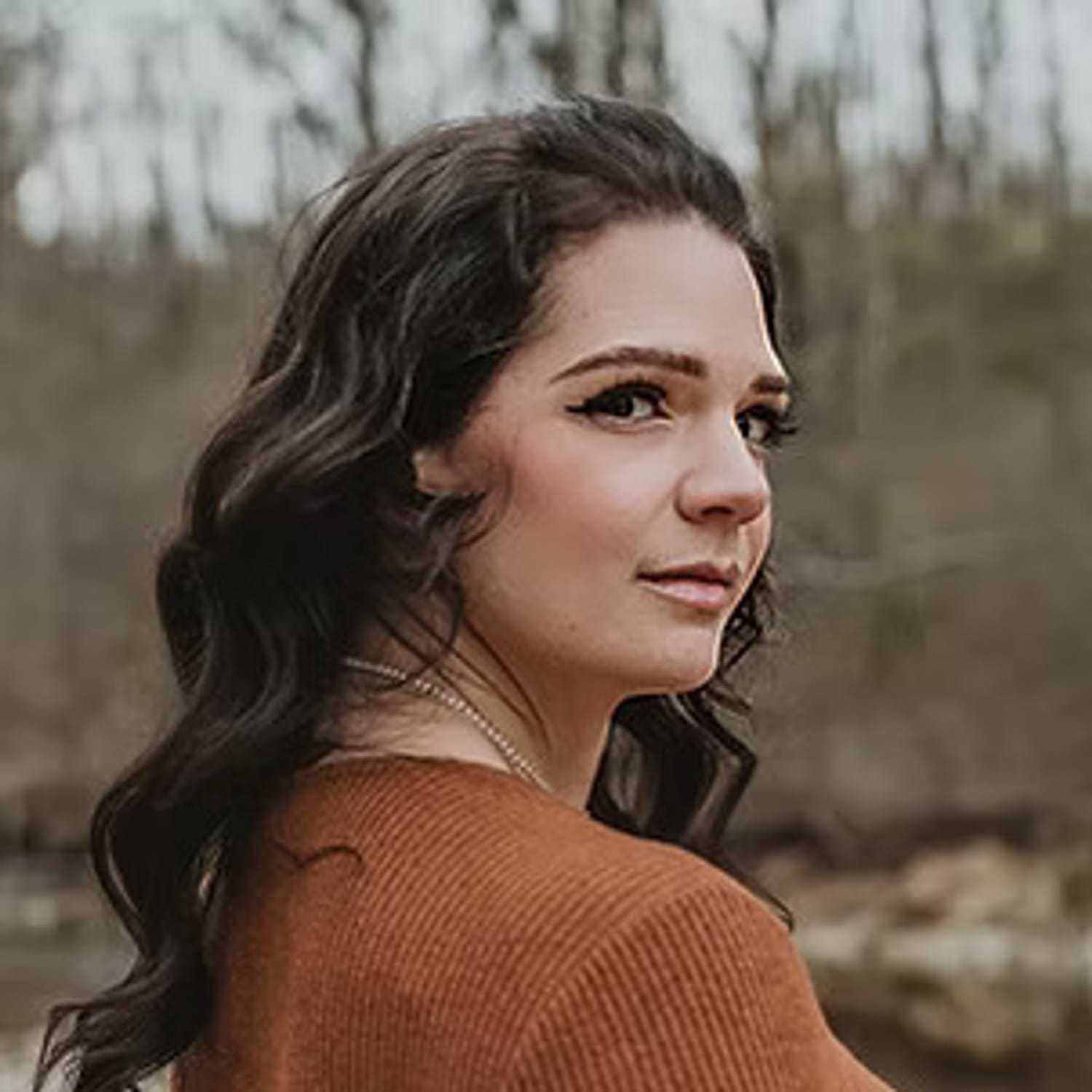 Portrait of Lindsay Hoffman, a professional stylist at Salon Stone & Spa, showcasing their expertise and style.