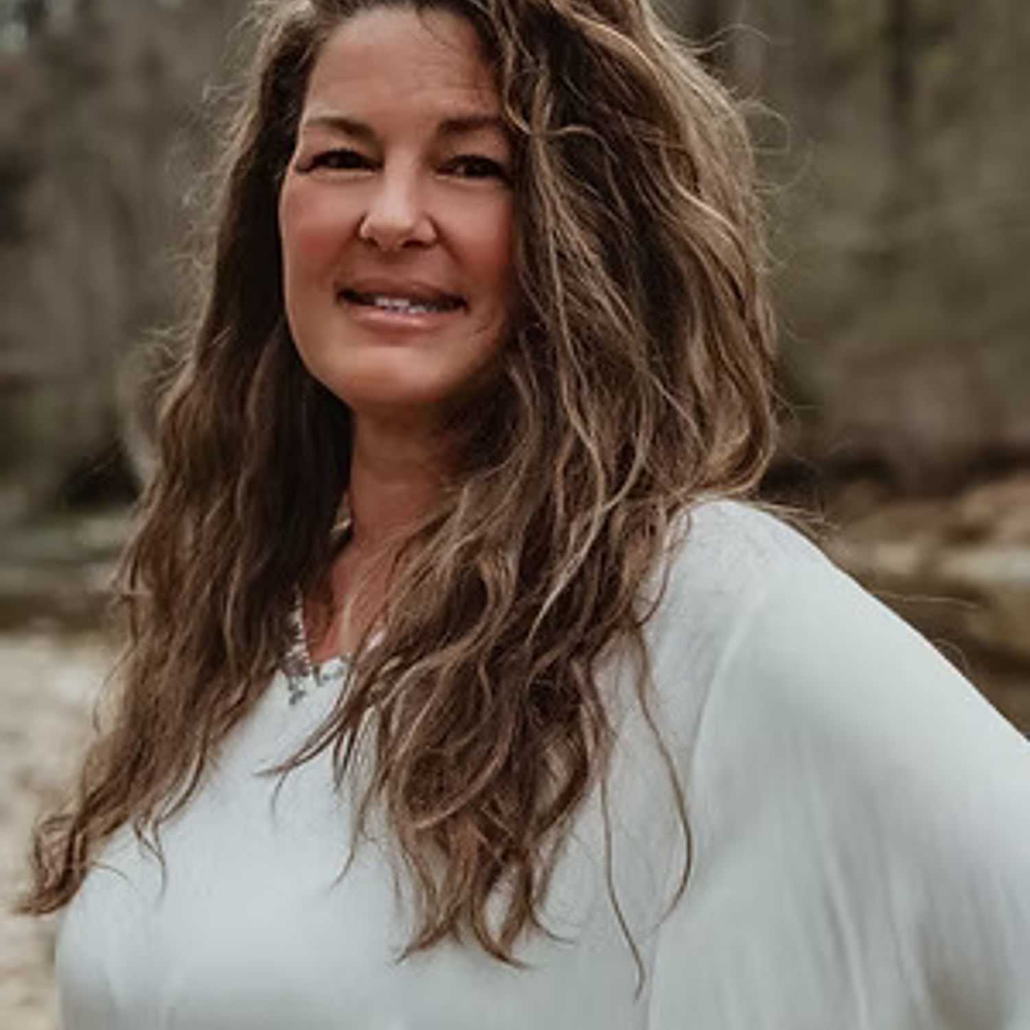 Portrait of Tara Reavis, a professional stylist at Salon Stone & Spa, showcasing their expertise and style.