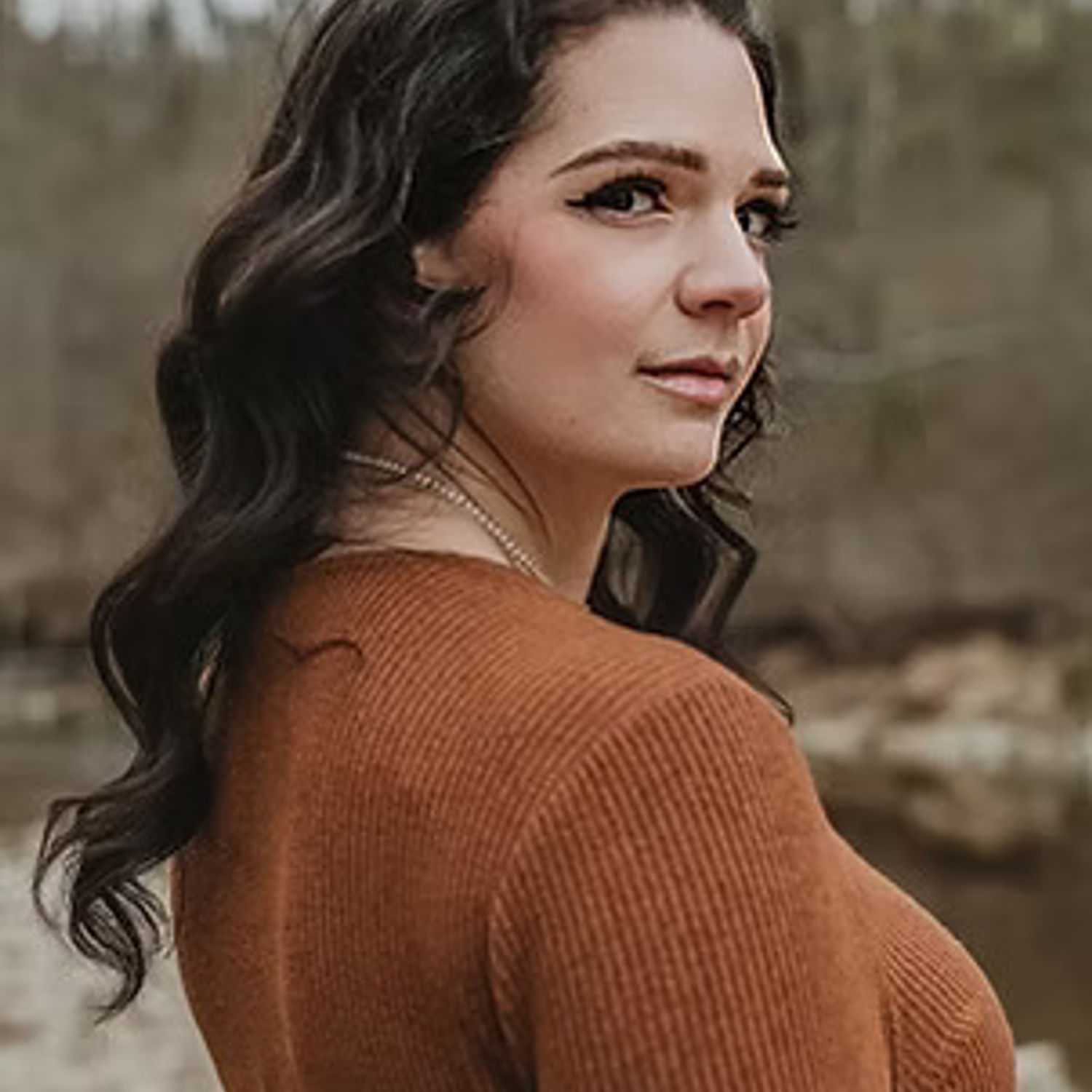 Portrait of Lindsay Hoffman, a professional stylist at Salon Stone & Spa, showcasing their expertise and style.