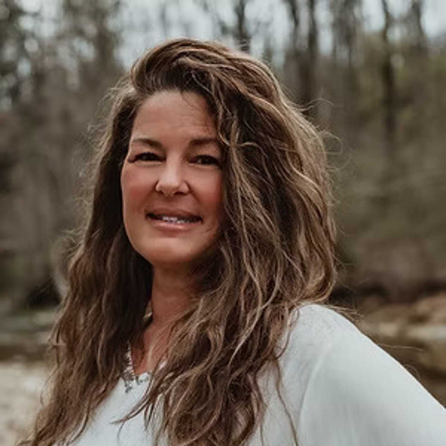 Portrait of Tara Reavis, a professional stylist at Salon Stone & Spa, showcasing their expertise and style.